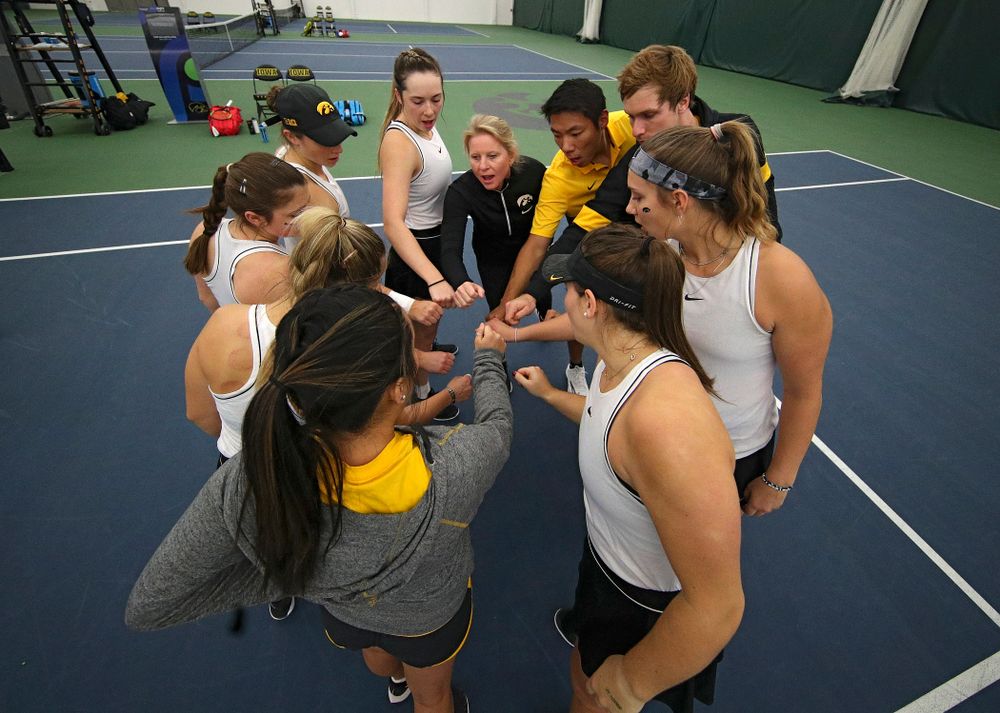 The Hawkeyes huddle before their match at the Hawkeye Tennis and Recreation Complex in Iowa City on Sunday, February 16, 2020. (Stephen Mally/hawkeyesports.com)