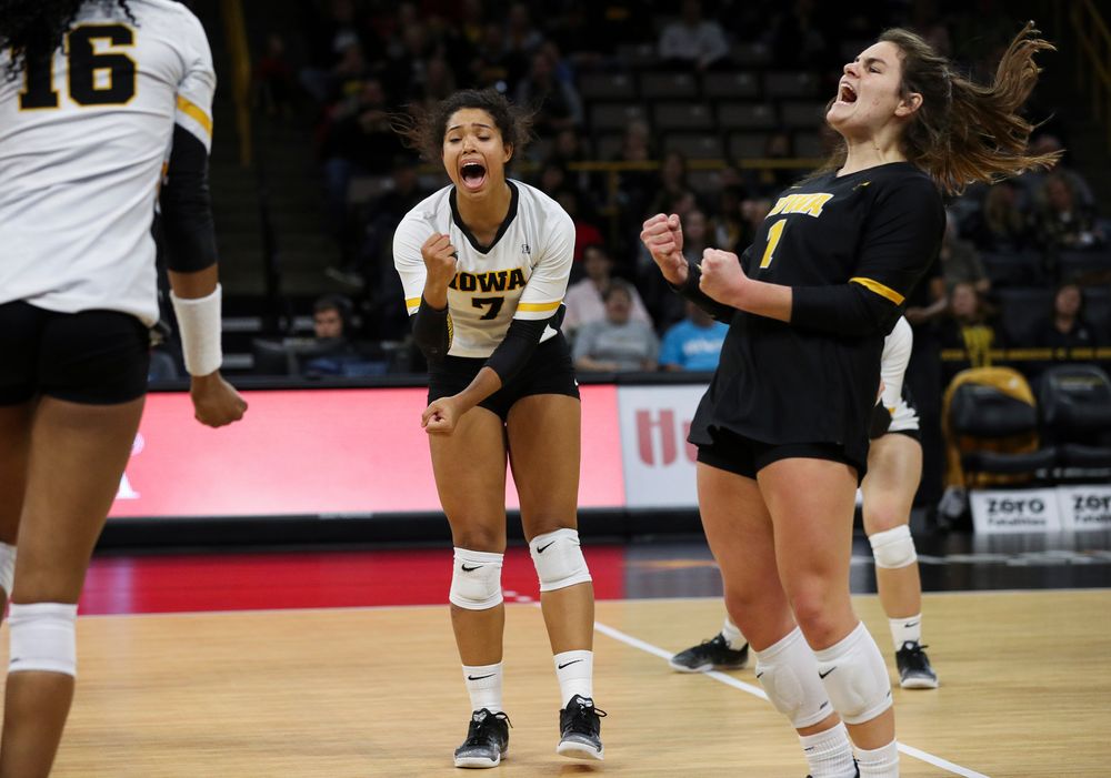 Iowa Hawkeyes setter Brie Orr (7) and Iowa Hawkeyes defensive specialist Molly Kelly (1) celebrate after winning a point during a match against Maryland at Carver-Hawkeye Arena on November 23, 2018. (Tork Mason/hawkeyesports.com)