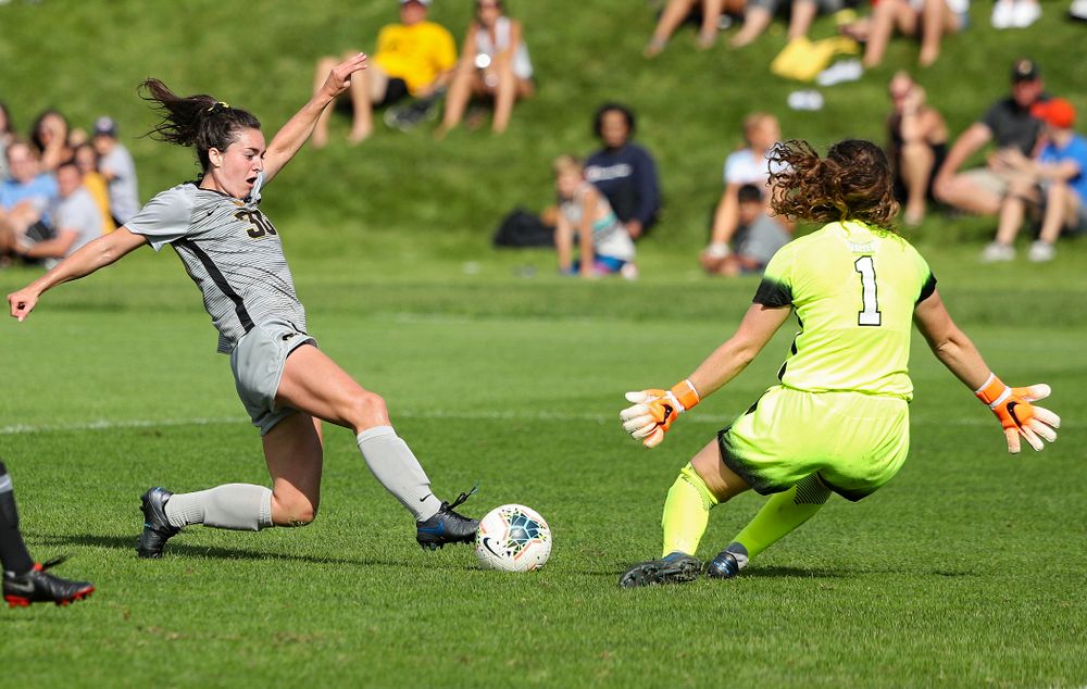 Iowa forward Devin Burns (30) tries to get the ball around the goalkeeper during the second half of their match at the Iowa Soccer Complex in Iowa City on Sunday, Sep 1, 2019. (Stephen Mally/hawkeyesports.com)
