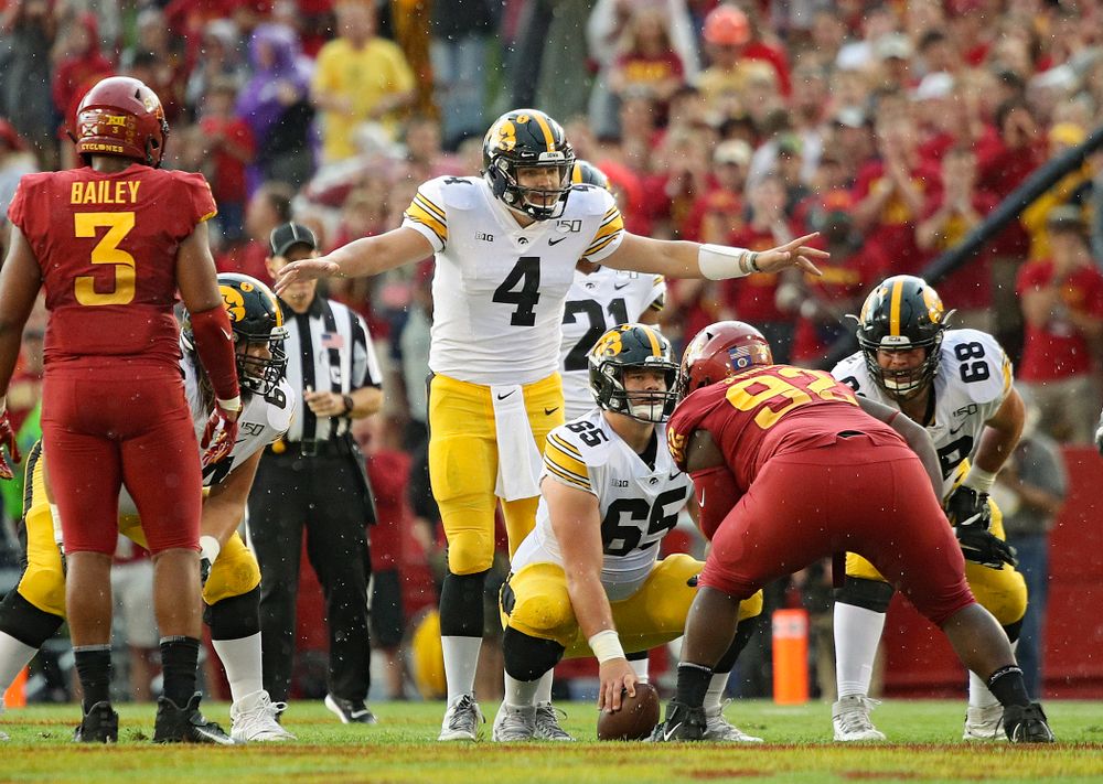 Iowa Hawkeyes quarterback Nate Stanley (4) motions as the line during the first quarter of their Iowa Corn Cy-Hawk Series game at Jack Trice Stadium in Ames on Saturday, Sep 14, 2019. (Stephen Mally/hawkeyesports.com)