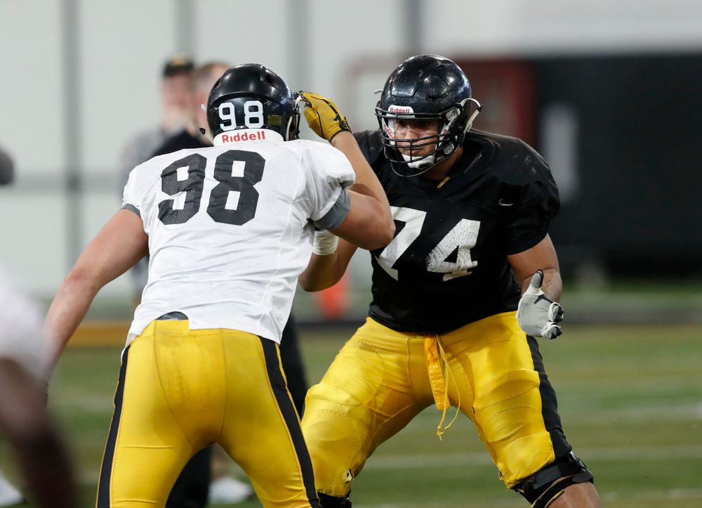 Iowa Hawkeyes offensive lineman Tristan Wirfs (74) and defensive end Anthony Nelson (98) Wednesday, April 4, 2018 at the Hansen Football Performance Center. (Brian Ray/hawkeyesports.com)
