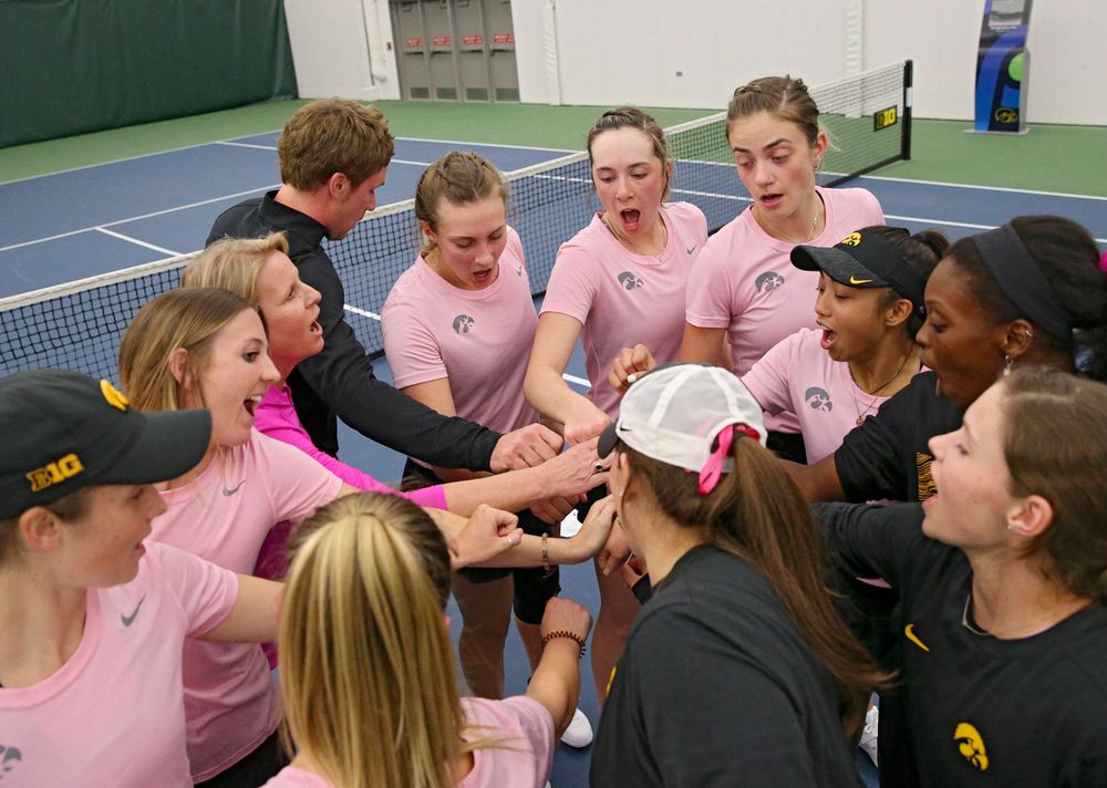 The Iowa Hawkeyes huddle after winning their match against Purdue at the Hawkeye Tennis and Recreation Complex in Iowa City on Friday, Mar. 29, 2019. (Stephen Mally/hawkeyesports.com)