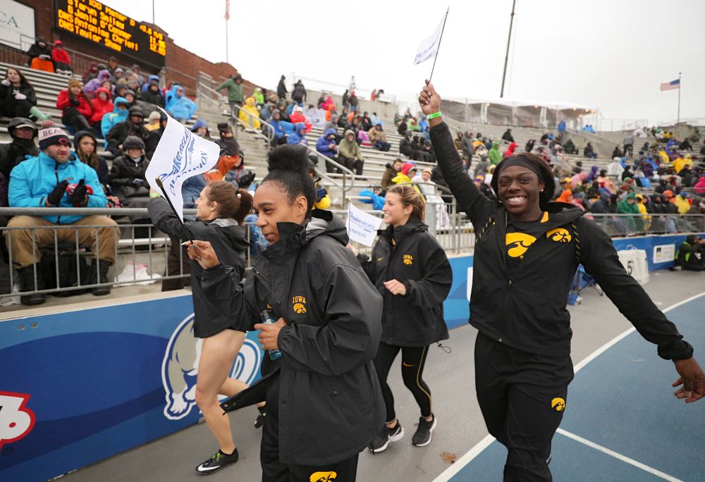 Iowa's Talia Buss (from left), Briana Guillory, Taylor Arco, and Antonise Christian take a victory lap after winning the women's sprint medley relay event during the third day of the Drake Relays at Drake Stadium in Des Moines on Saturday, Apr. 27, 2019. (Stephen Mally/hawkeyesports.com)
