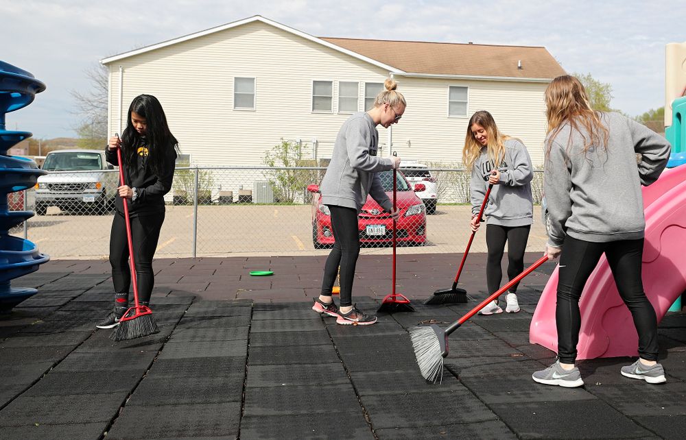 Iowa women's gymnasts clean outside Handicare during the 21st annual ISAAC Hawkeye Day of Caring in Coralville on Sunday, Apr. 28, 2019. (Stephen Mally/hawkeyesports.com)