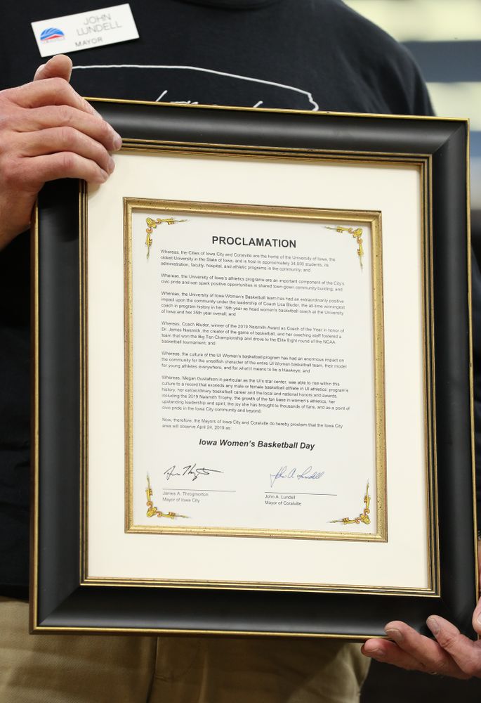 Iowa City Mayor Jim Throgmorton and Coralville Mayor John Lundell present Iowa Hawkeyes head coach Lisa Bluder with a joint proclamation designating April 24, 2019 as Iowa WomenÕs Basketball Day during the teamÕs Celebr-Eight event Wednesday, April 24, 2019 at Carver-Hawkeye Arena. (Brian Ray/hawkeyesports.com)