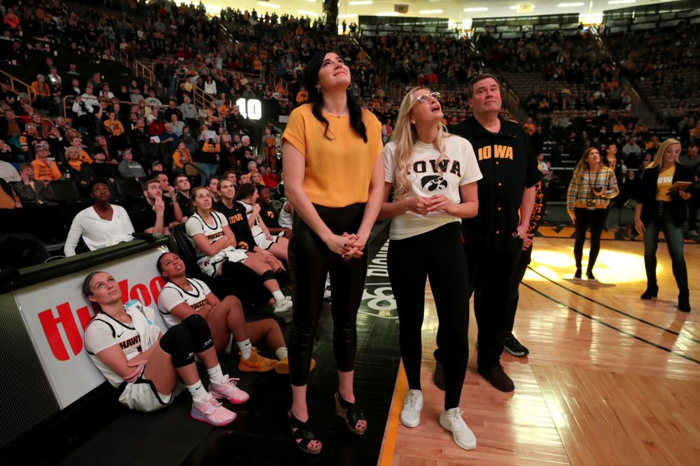 Megan Gustafson watches a video message from her teammates and coaches after her number was raised into the rafters during a jersey retirement ceremony Sunday, January 26, 2020 at Carver-Hawkeye Arena. (Brian Ray/hawkeyesports.com)