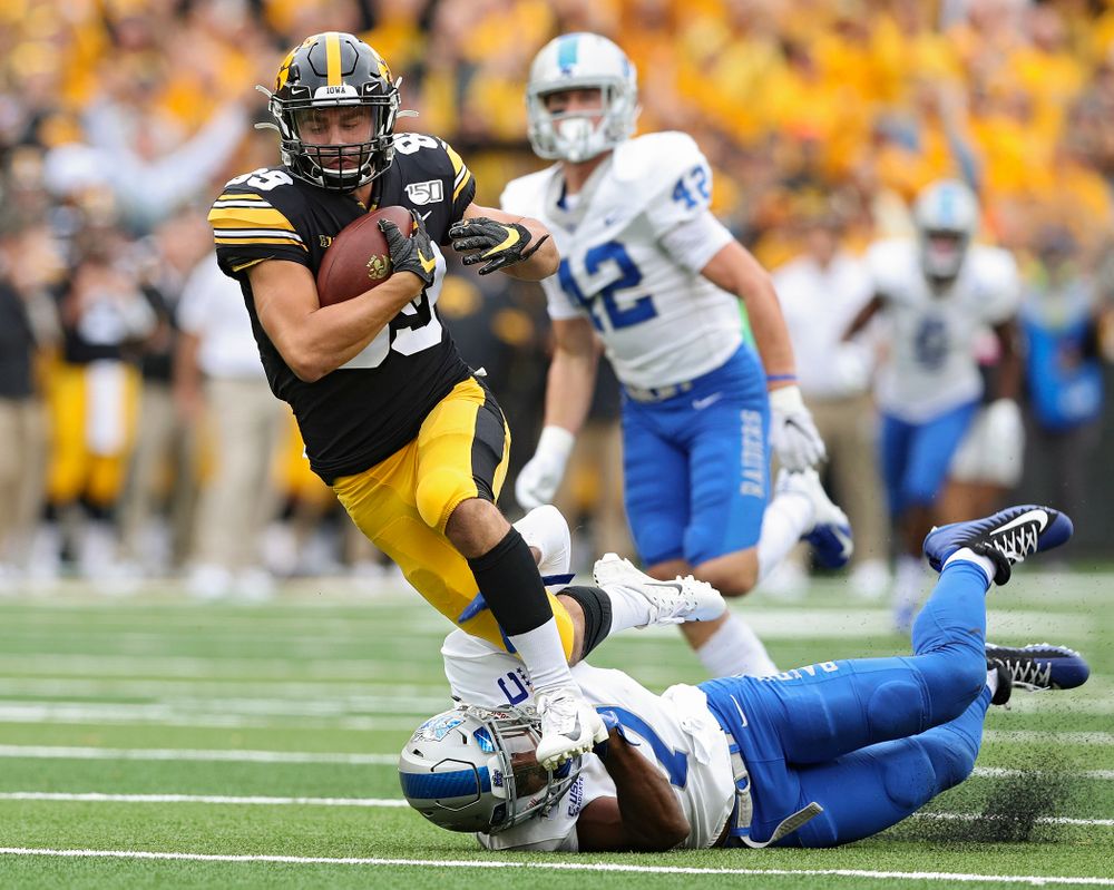 Iowa Hawkeyes wide receiver Nico Ragaini (89) is tripped up after cartching a pass during fourth quarter of their game at Kinnick Stadium in Iowa City on Saturday, Sep 28, 2019. (Stephen Mally/hawkeyesports.com)