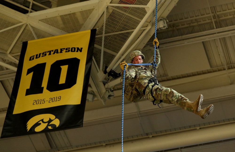 Members of the Iowa Army and Air Force ROTC rappel down from the rafters before the Iowa Hawkeyes game against Penn State Saturday, February 29, 2020 at Carver-Hawkeye Arena. (Brian Ray/hawkeyesports.com)