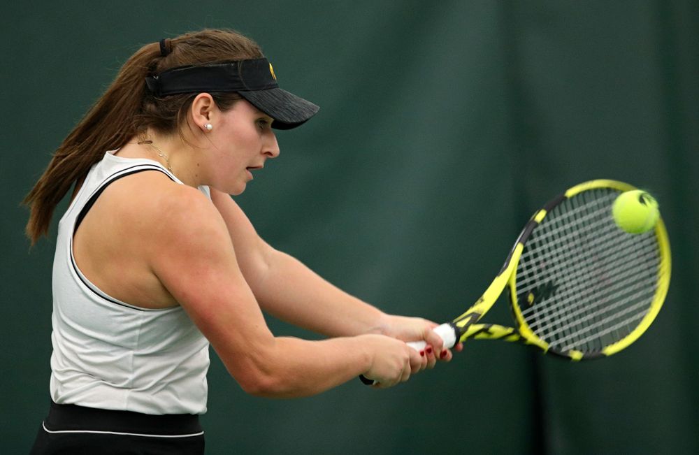Iowa’s Danielle Bauers returns a shot during her singles match at the Hawkeye Tennis and Recreation Complex in Iowa City on Sunday, February 16, 2020. (Stephen Mally/hawkeyesports.com)