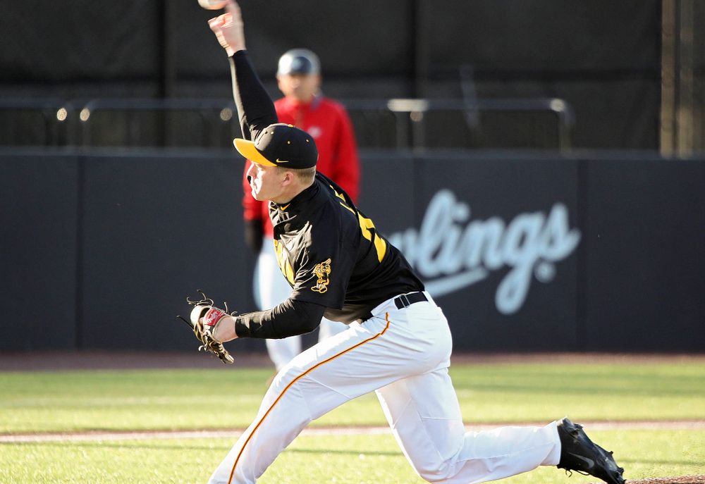 Iowa pitcher Hunter Lee (24) delivers to the plate during the first inning of their game at Duane Banks Field in Iowa City on Tuesday, March 3, 2020. (Stephen Mally/hawkeyesports.com)