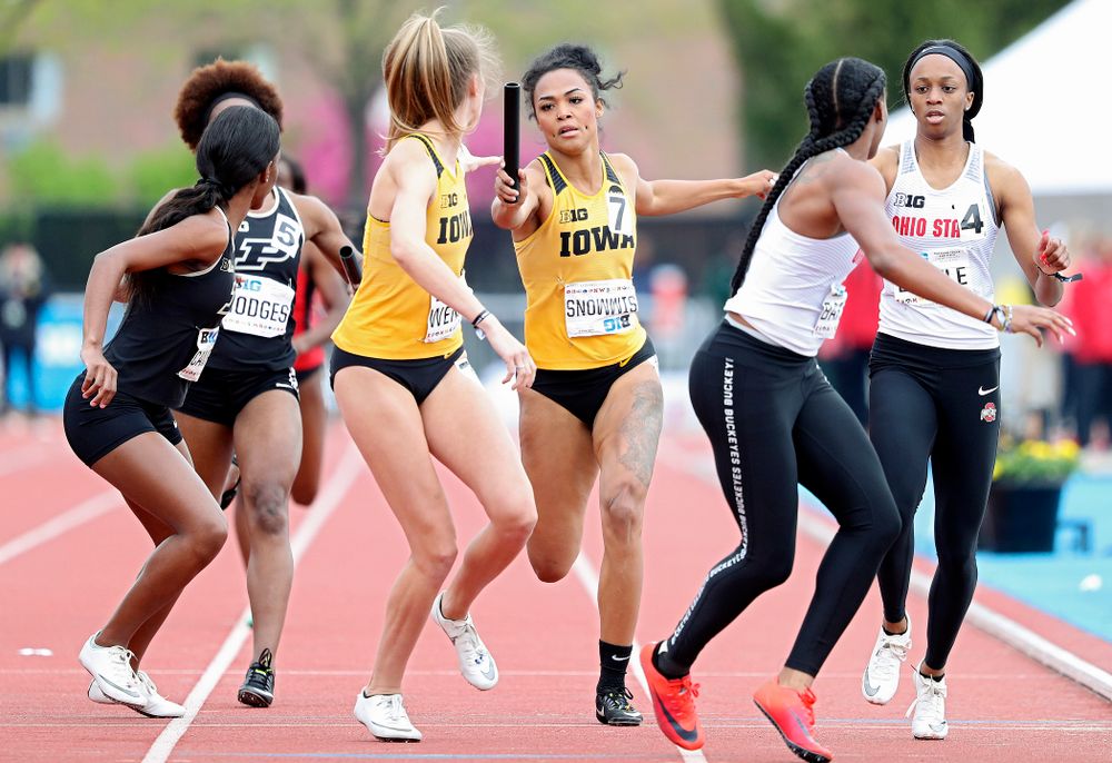 Iowa's Tria Simmons (right) hands off the baton to Payton Wensel during the women’s 1600 meter relay event on the third day of the Big Ten Outdoor Track and Field Championships at Francis X. Cretzmeyer Track in Iowa City on Sunday, May. 12, 2019. (Stephen Mally/hawkeyesports.com)