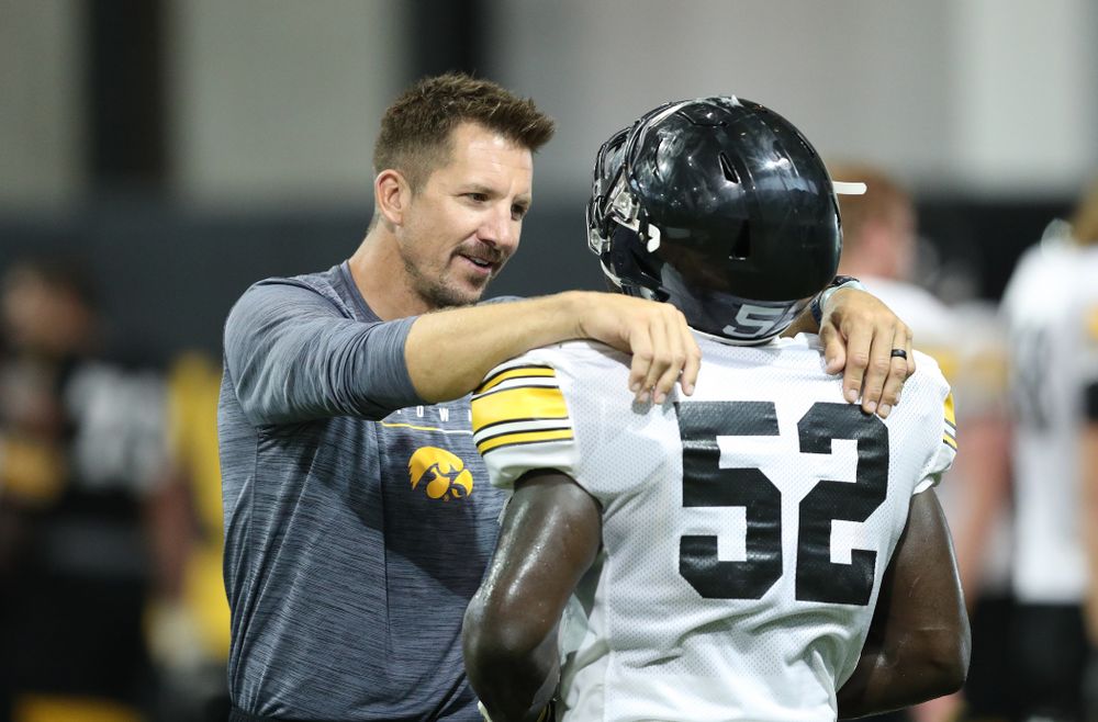 Dallas Clark and Iowa Hawkeyes linebacker Amani Jones (52)during Fall Camp Practice No. 16 Tuesday, August 20, 2019 at the Ronald D. and Margaret L. Kenyon Football Practice Facility. (Brian Ray/hawkeyesports.com)