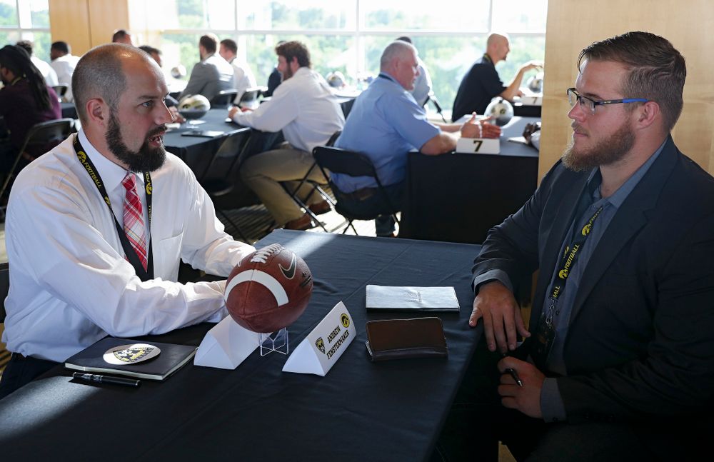 Andrew Fenstermaker (from left), former Iowa punter, talks with offensive lineman Landan Paulsen as former players meet with members of the current Hawkeye Football team during a networking event at Kinnick Stadium in Iowa City on Thursday, Jun 6, 2019. (Stephen Mally/hawkeyesports.com)