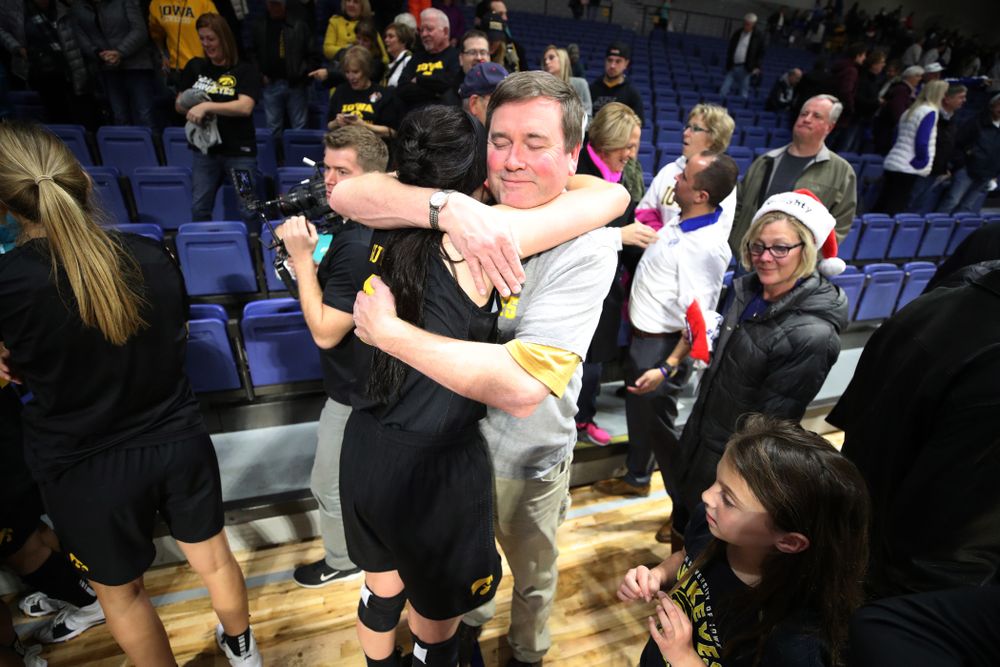 Iowa Hawkeyes forward Megan Gustafson (10) hugs her father Clendon following their win over the Drake Bulldogs Friday, December 21, 2018 at the Knapp Center in Des Moines. (Brian Ray/hawkeyesports.com)