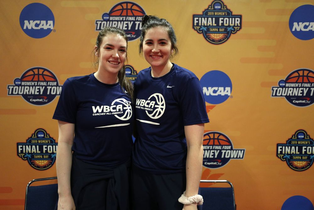 Iowa Hawkeyes forward Megan Gustafson (10) and Iowa State's Bridget Carleton after signing autographs with the other WBCA All Americans at the Tourney Town Fan Fest Friday, April 5, 2019 at the Tampa Convention Center in Tampa, FL. (Brian Ray/hawkeyesports.com)