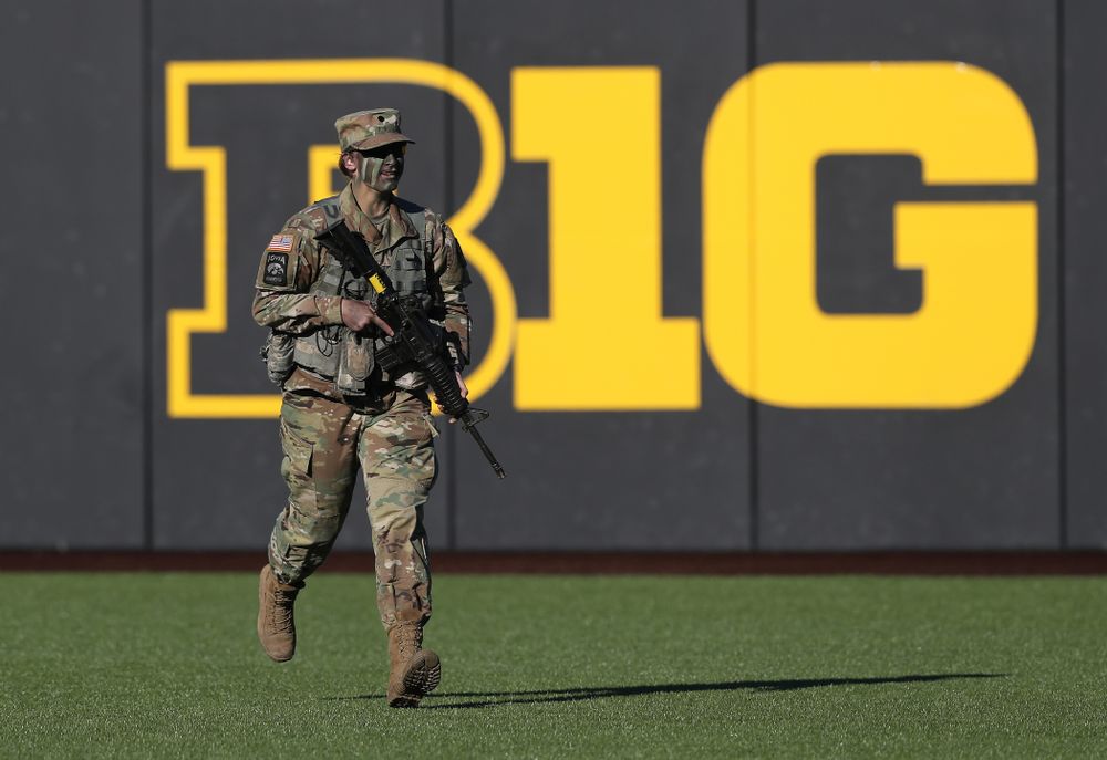 Members of the University of Iowa ROTC deliver the game ball before the Iowa Hawkeyes game against the Nebraska Cornhuskers on Military Appreciation Night Friday, April 19, 2019 at Duane Banks Field. (Brian Ray/hawkeyesports.com)