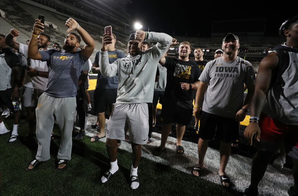 Members o the Iowa Football Team are not impressed by the new players first rendition of the ÒFight SongÓ  Thursday, August 22, 2019 at Kinnick Stadium in Iowa City. (Brian Ray/hawkeyesports.com)