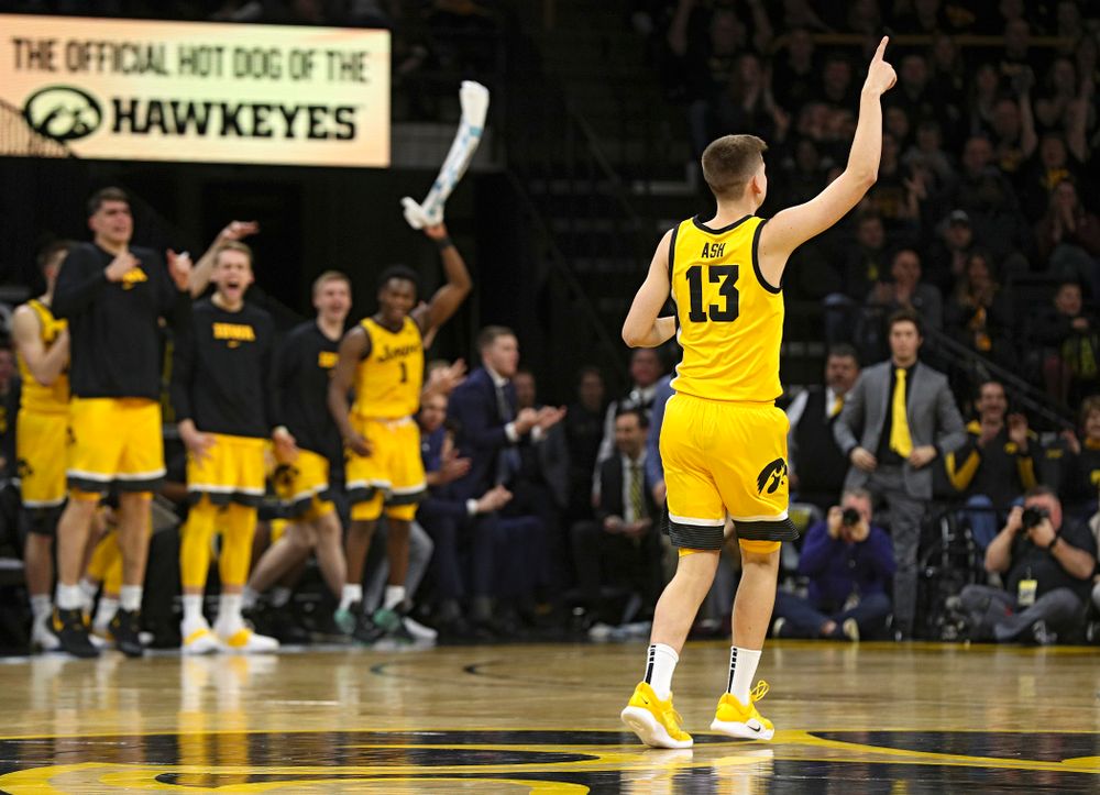 Iowa Hawkeyes guard Austin Ash (13) celebrates after making a 3-pointer during the second half of their game at Carver-Hawkeye Arena in Iowa City on Saturday, February 8, 2020. (Stephen Mally/hawkeyesports.com)