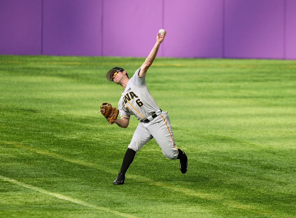 Iowa Hawkeyes outfielder Justin Jenkins (6) throws the ball back to the infield during the fourth inning of their CambriaCollegeClassic game at U.S. Bank Stadium in Minneapolis, Minn. on Friday, February 28, 2020. (Stephen Mally/hawkeyesports.com)