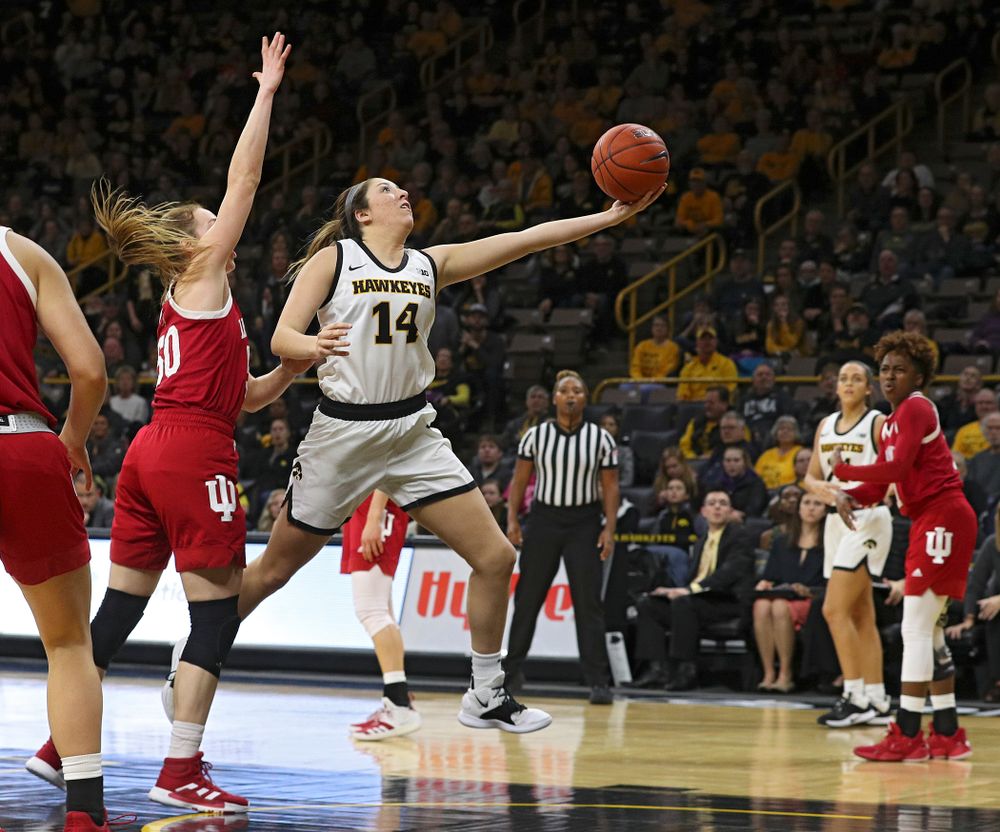 Iowa Hawkeyes guard Mckenna Warnock (14) makes a basket during the third quarter of their game at Carver-Hawkeye Arena in Iowa City on Sunday, January 12, 2020. (Stephen Mally/hawkeyesports.com)