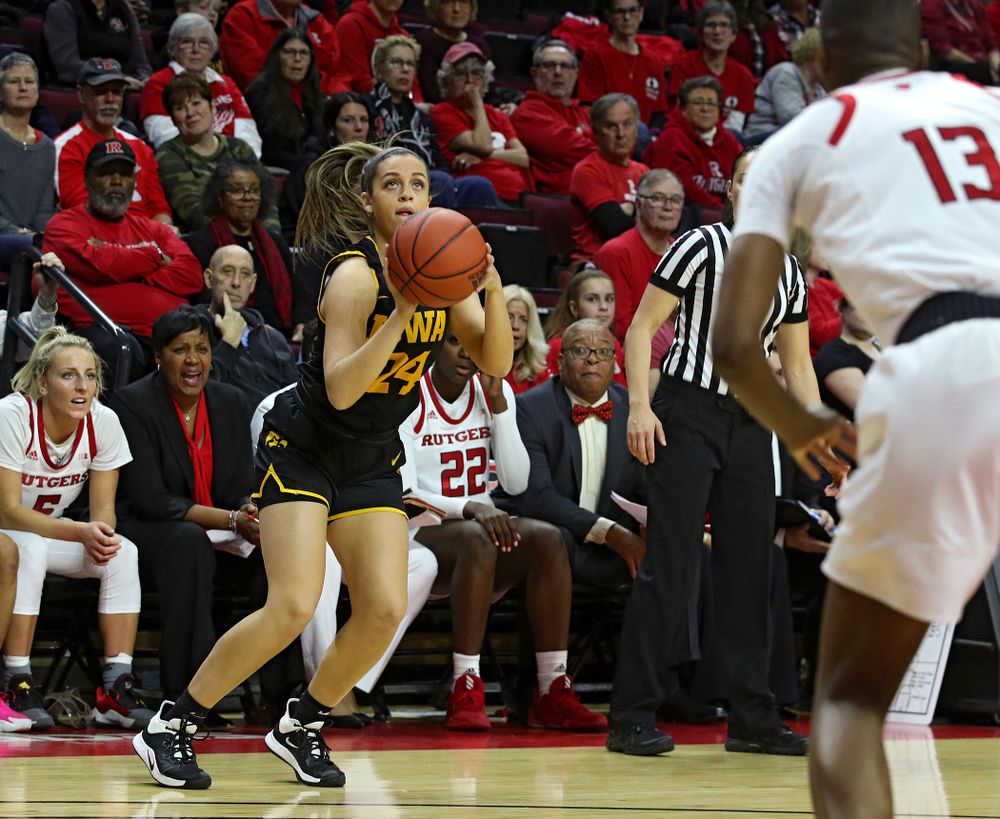 Iowa guard Gabbie Marshall (24) makes a 3-pointer during the first quarter of their game at the Rutgers Athletic Center in Piscataway, N.J. on Sunday, March 1, 2020. (Stephen Mally/hawkeyesports.com)