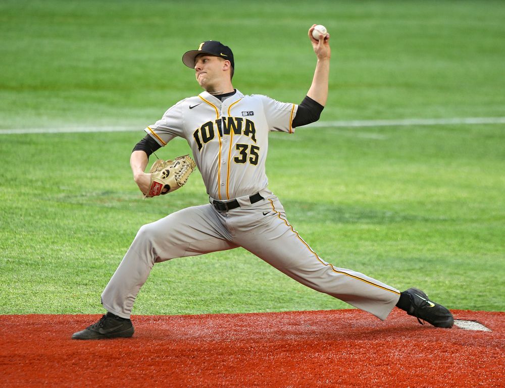 Iowa Hawkeyes pitcher Cam Baumann (35) delivers to the plate during the eighth inning of their CambriaCollegeClassic game at U.S. Bank Stadium in Minneapolis, Minn. on Friday, February 28, 2020. (Stephen Mally/hawkeyesports.com)