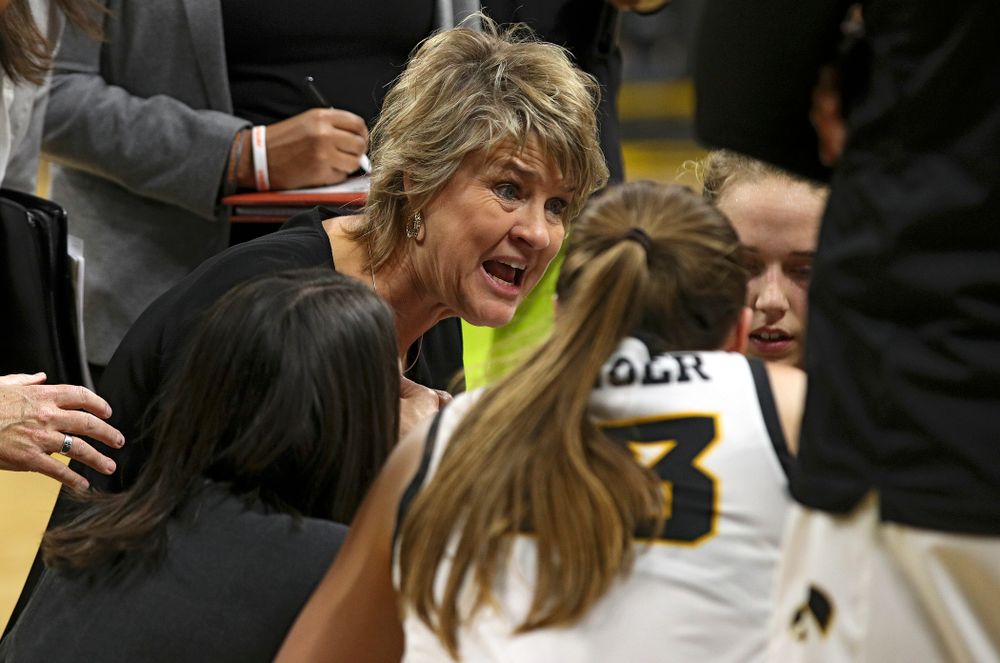 Iowa head coach Lisa Bluder talks with her team during a timeout in the fourth quarter of their overtime win against Princeton at Carver-Hawkeye Arena in Iowa City on Wednesday, Nov 20, 2019. (Stephen Mally/hawkeyesports.com)