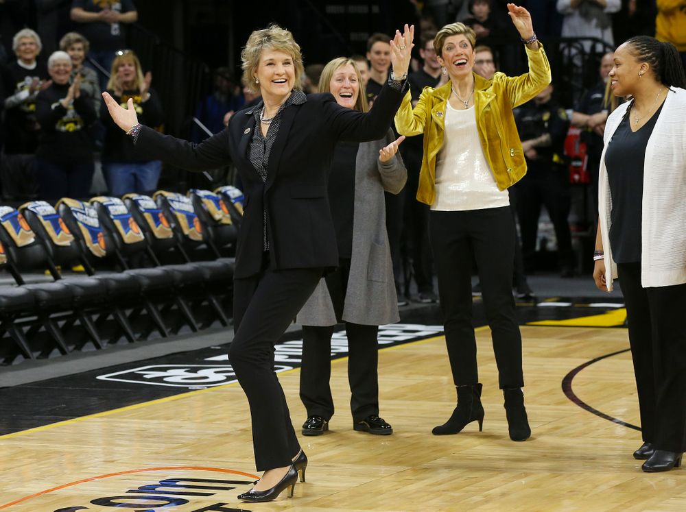 Iowa Hawkeyes head coach Lisa Bluder reacts after her daughter Emma Bluder (not pictured), didn't see her coming to hug her after Emma sung the National Anthem before their second round game in the 2019 NCAA Women's Basketball Tournament at Carver Hawkeye Arena in Iowa City on Sunday, Mar. 24, 2019. (Stephen Mally for hawkeyesports.com)