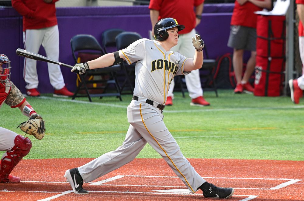 Iowa Hawkeyes first baseman Peyton Williams (45) drives a pitch for a double during the fifth inning of their CambriaCollegeClassic game at U.S. Bank Stadium in Minneapolis, Minn. on Friday, February 28, 2020. (Stephen Mally/hawkeyesports.com)