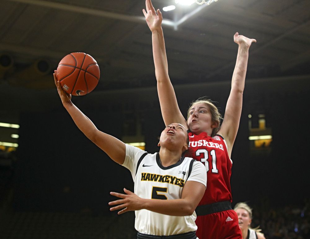 Iowa Hawkeyes guard Alexis Sevillian (5) makes a basket during the second quarter of the game at Carver-Hawkeye Arena in Iowa City on Thursday, February 6, 2020. (Stephen Mally/hawkeyesports.com)