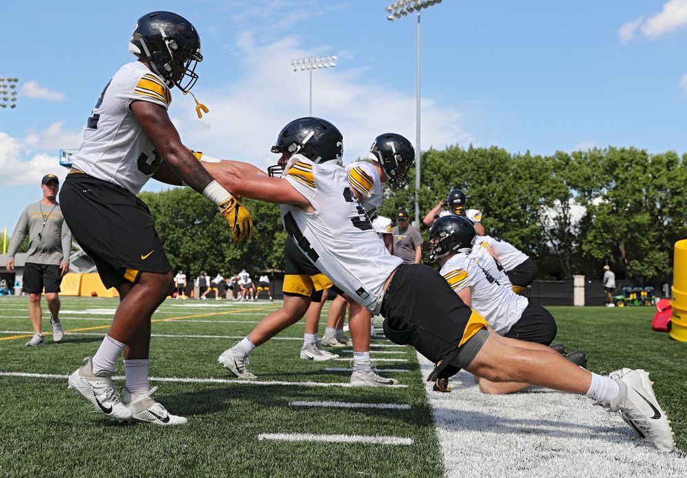 Iowa Hawkeyes linebacker Djimon Colbert (from left) and linebacker Kristian Welch (34) run a drill during Fall Camp Practice No. 13 at the Hansen Football Performance Center in Iowa City on Friday, Aug 16, 2019. (Stephen Mally/hawkeyesports.com)