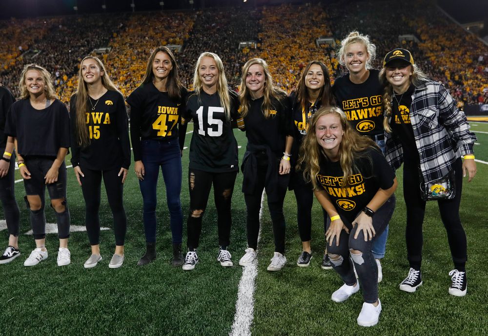 Members of the Iowa field hockey team are recognized by the Presidential Committee on Athletics at halftime during a game against Wisconsin on September 22, 2018. (Tork Mason/hawkeyesports.com)