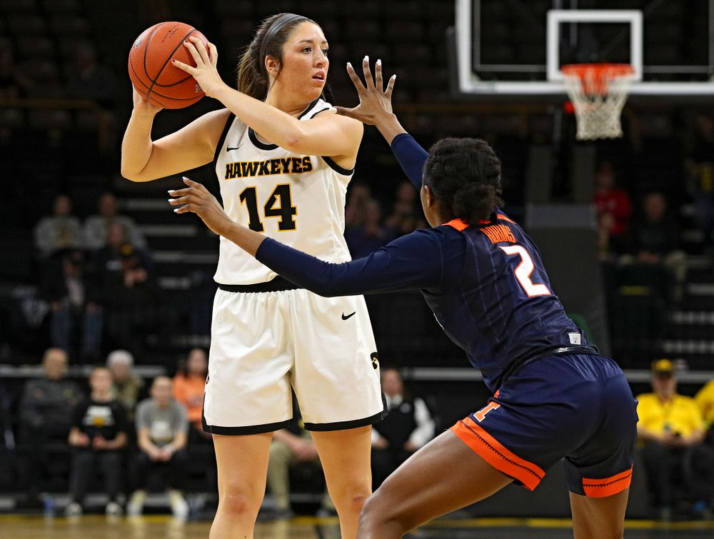 Iowa Hawkeyes guard Mckenna Warnock (14) looks to pass during the second quarter of their game at Carver-Hawkeye Arena in Iowa City on Tuesday, December 31, 2019. (Stephen Mally/hawkeyesports.com)