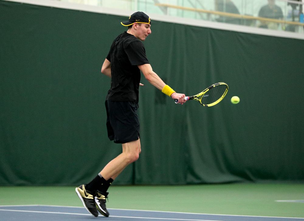 Iowa’s Nikita Snezhko returns a shot during his singles match at the Hawkeye Tennis and Recreation Complex in Iowa City on Friday, March 6, 2020. (Stephen Mally/hawkeyesports.com)