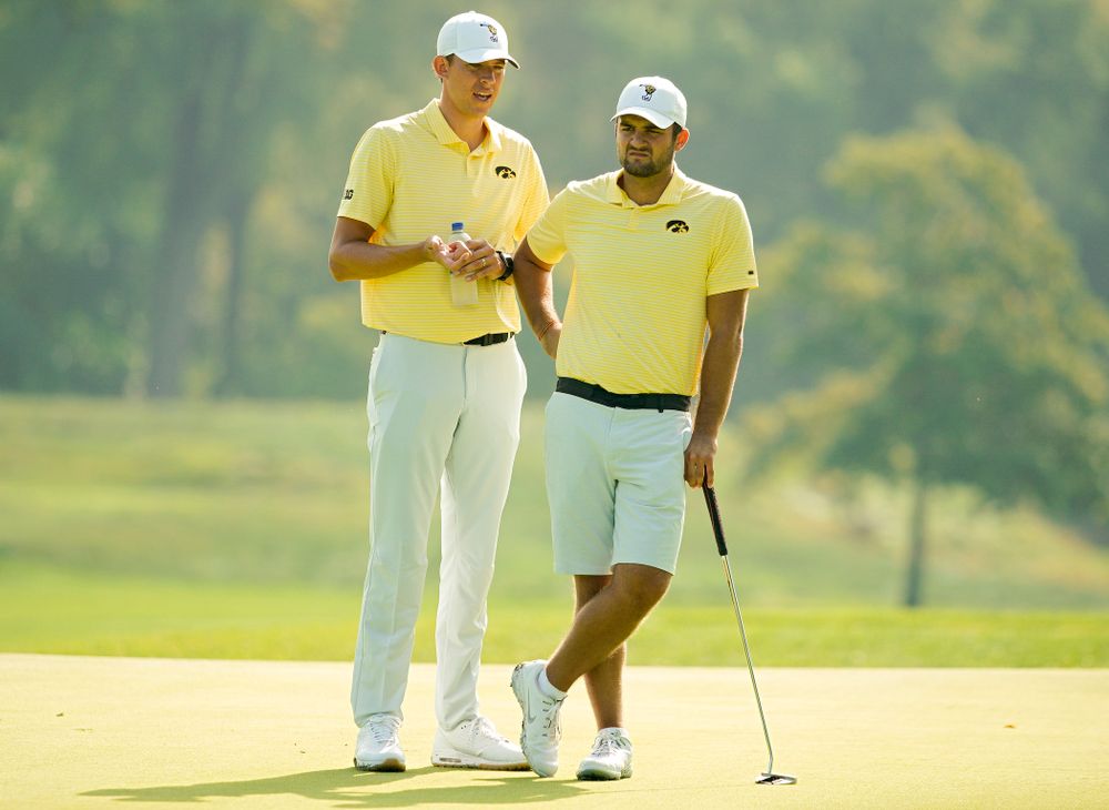 Iowa assistant coach Charlie Hoyle (from left) talks with Gonzalo Leal during the third day of the Golfweek Conference Challenge at the Cedar Rapids Country Club in Cedar Rapids on Tuesday, Sep 17, 2019. (Stephen Mally/hawkeyesports.com)