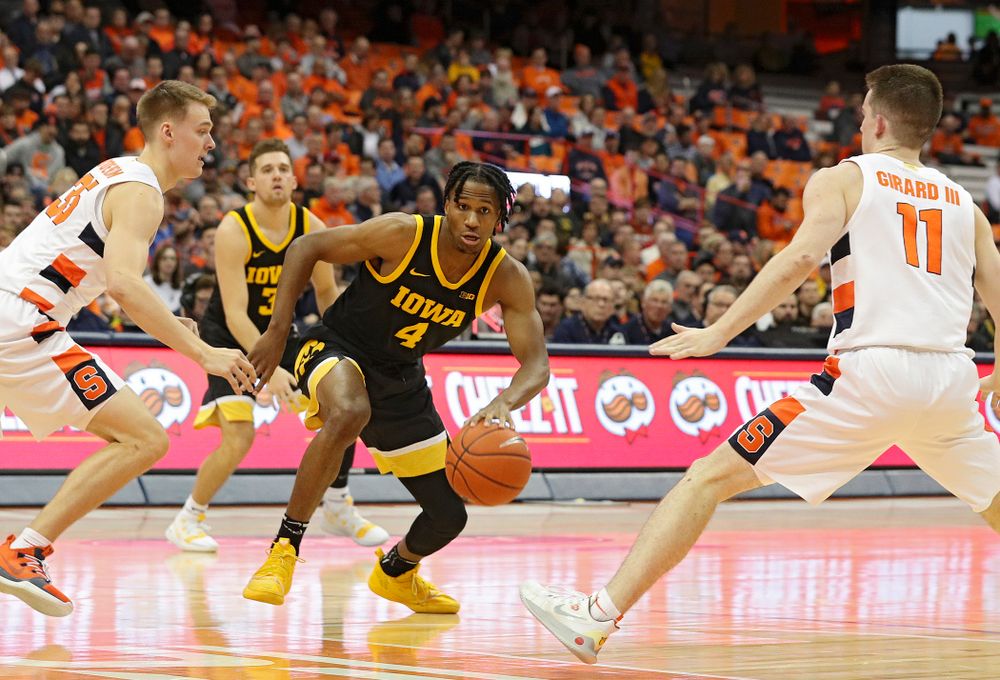 Iowa Hawkeyes guard Bakari Evelyn (4) drives with the ball during the first half of their ACC/Big Ten Challenge game at the Carrier Dome in Syracuse, N.Y. on Tuesday, Dec 3, 2019. (Stephen Mally/hawkeyesports.com)