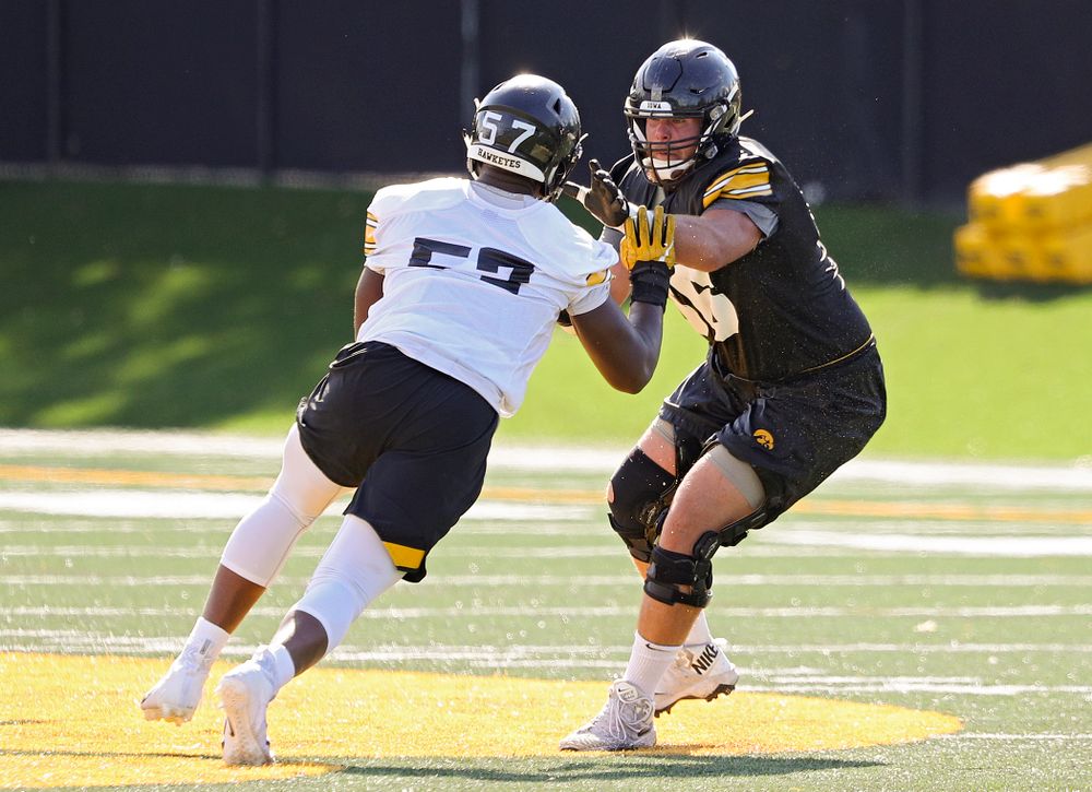 Iowa Hawkeyes defensive end Chauncey Golston (57) tries to get around offensive lineman Levi Paulsen (66) during Fall Camp Practice No. 13 at the Hansen Football Performance Center in Iowa City on Friday, Aug 16, 2019. (Stephen Mally/hawkeyesports.com)