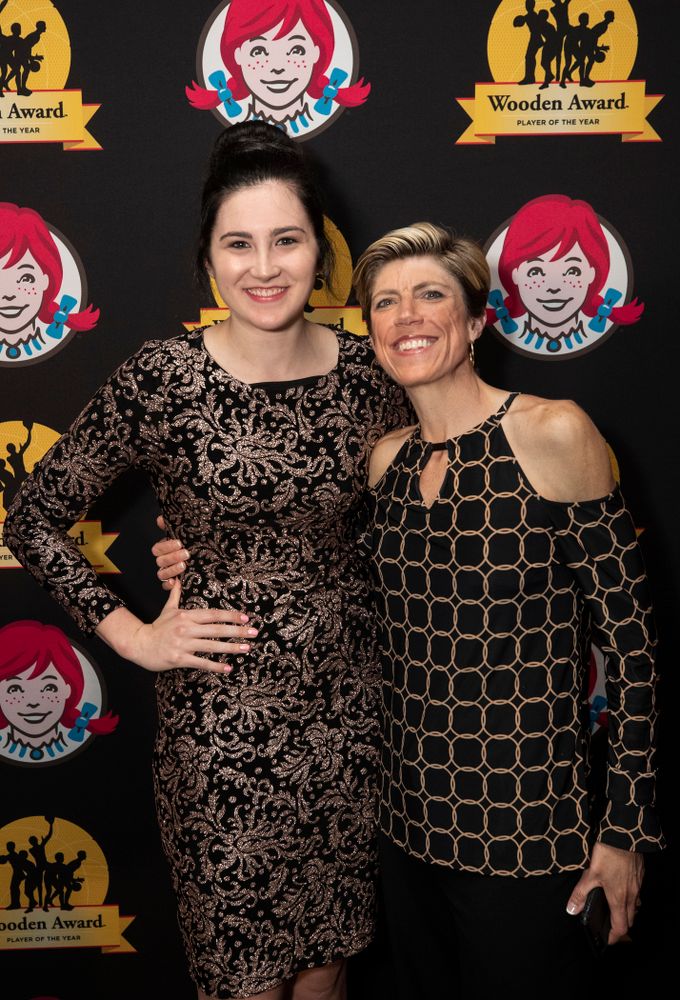 Iowa Hawkeyes forward Megan Gustafson (10) and associate head coach Jan Jensen on the red carpet before the ESPN College Basketball Awards show Friday, April 12, 2019 at The Novo at LA Live.  (Brian Ray/hawkeyesports.com)