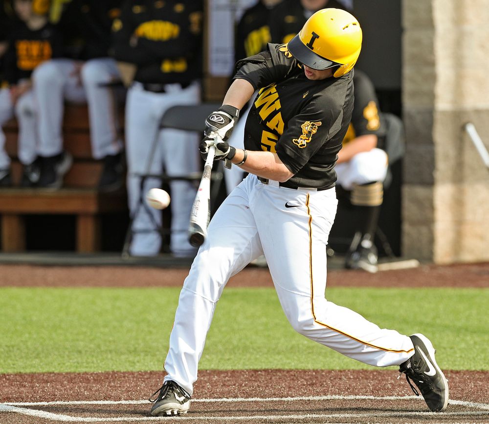 Iowa Hawkeyes first baseman Zeb Adreon (5) hits an RBI single during the sixth inning of their game against Rutgers at Duane Banks Field in Iowa City on Saturday, Apr. 6, 2019. (Stephen Mally/hawkeyesports.com)