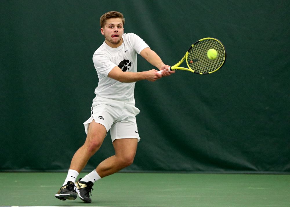 Iowa’s Will Davies returns a shot during his singles match at the Hawkeye Tennis and Recreation Complex in Iowa City on Sunday, February 16, 2020. (Stephen Mally/hawkeyesports.com)