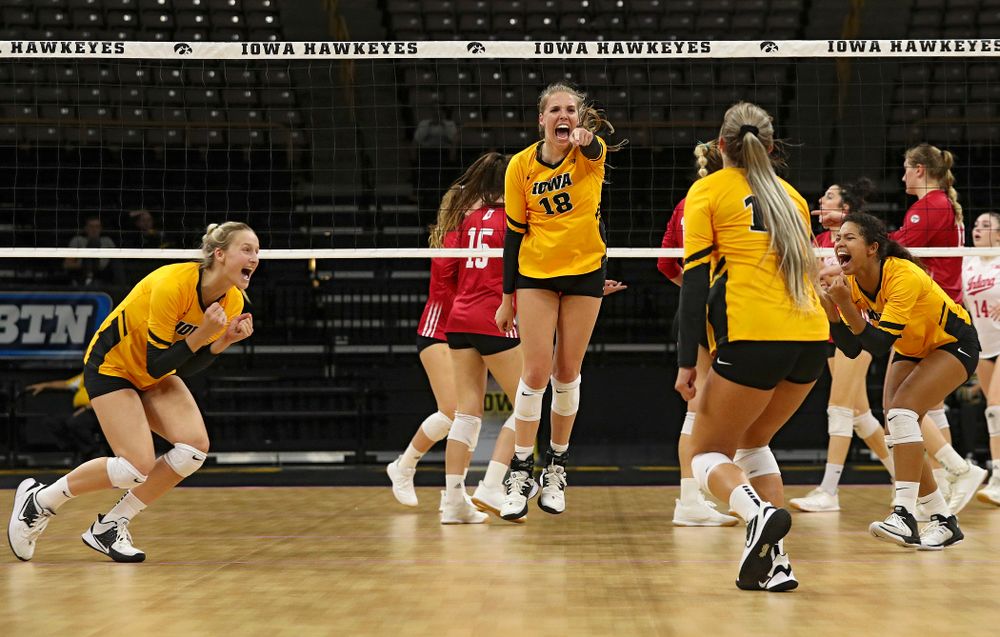 Iowa’s Kyndra Hansen (8), Hannah Clayton (18), Maddie Slagle (15), and Brie Orr (7) celebrate a score during their match at Carver-Hawkeye Arena in Iowa City on Sunday, Oct 20, 2019. (Stephen Mally/hawkeyesports.com)