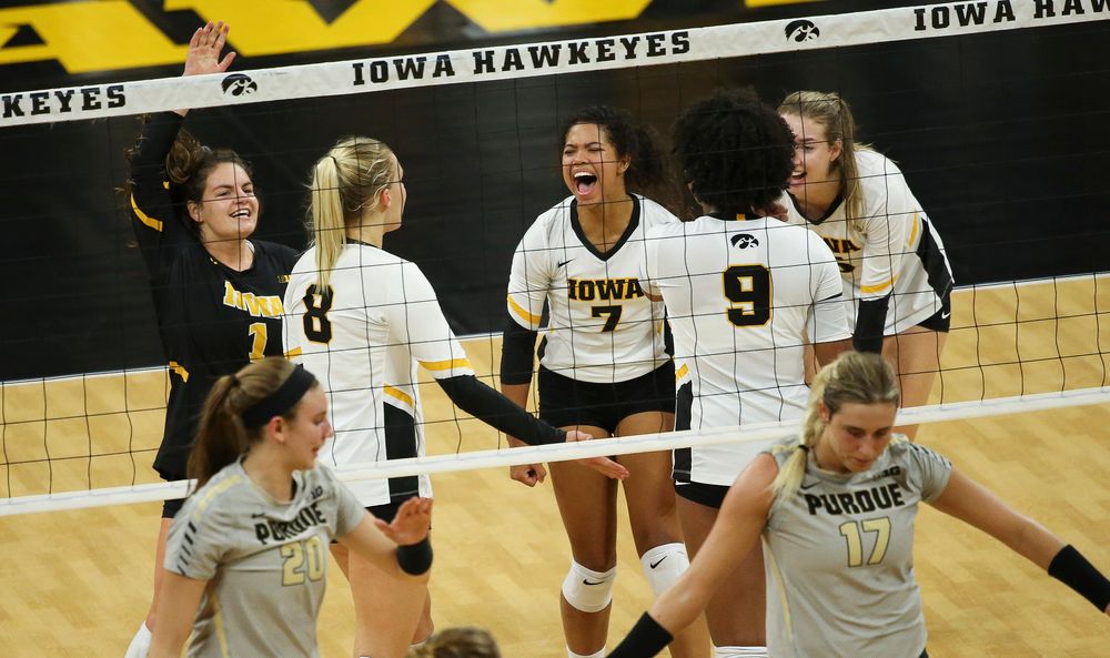 Iowa Hawkeyes defensive specialist Molly Kelly (1) and Iowa Hawkeyes setter Brie Orr (7) react after winning a point during a game against Purdue at Carver-Hawkeye Arena on October 13, 2018. (Tork Mason/hawkeyesports.com)