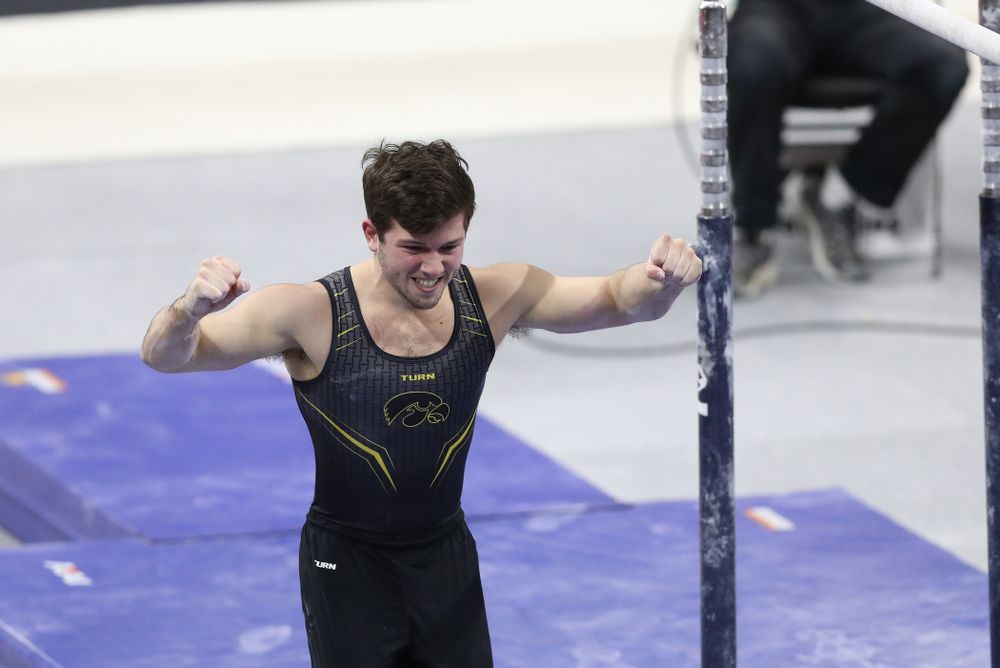 Iowa's Rogelio Vazquez competes on the parallel bars against Oklahoma Saturday, February 9, 2019 at Carver-Hawkeye Arena. (Brian Ray/hawkeyesports.com)