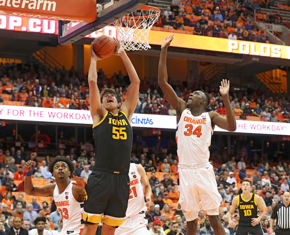 Iowa Hawkeyes center Luka Garza (55) makes a basket during the first half of their ACC/Big Ten Challenge game at the Carrier Dome in Syracuse, N.Y. on Tuesday, Dec 3, 2019. (Stephen Mally/hawkeyesports.com)