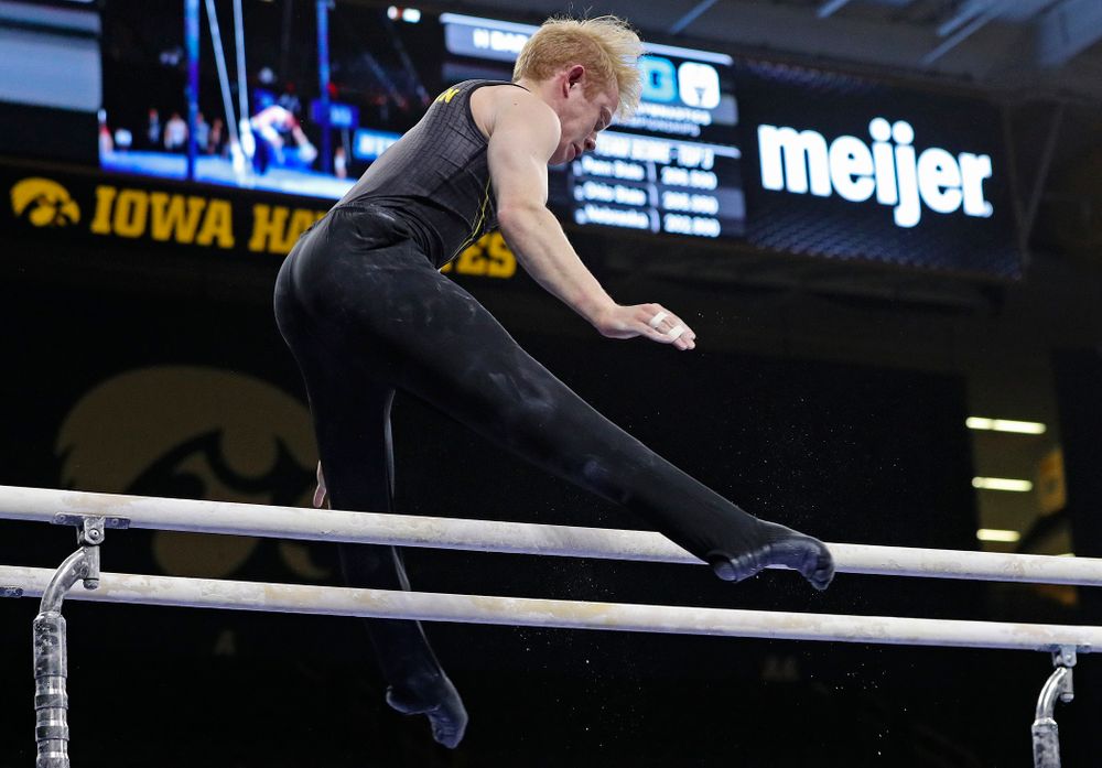 Iowa's Nick Merryman competes in the parallel bars during the first day of the Big Ten Men's Gymnastics Championships at Carver-Hawkeye Arena in Iowa City on Friday, Apr. 5, 2019. (Stephen Mally/hawkeyesports.com)