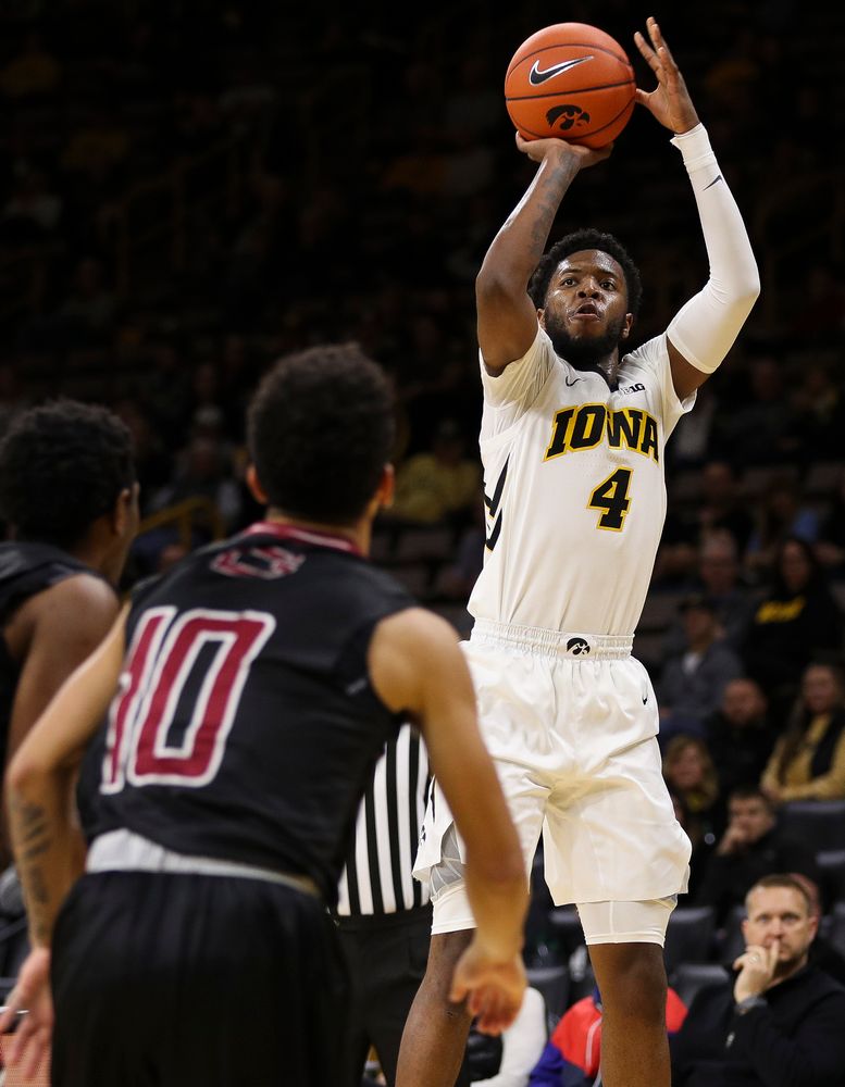 Iowa Hawkeyes guard Isaiah Moss (4) puts up a 3-pointer during a game against Guilford College at Carver-Hawkeye Arena on November 4, 2018. (Tork Mason/hawkeyesports.com)