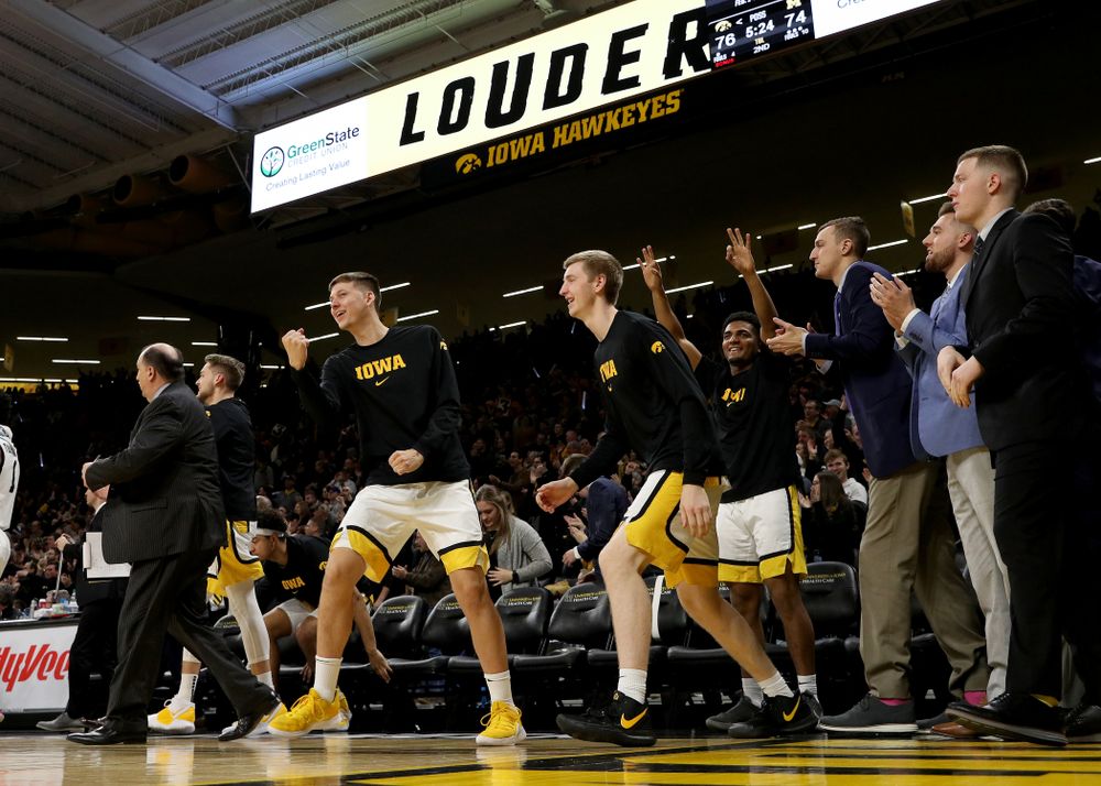 Iowa Hawkeyes guard Austin Ash (13) pumps his fist on the bench against the Michigan Wolverines Friday, January 17, 2020 at Carver-Hawkeye Arena. (Brian Ray/hawkeyesports.com)