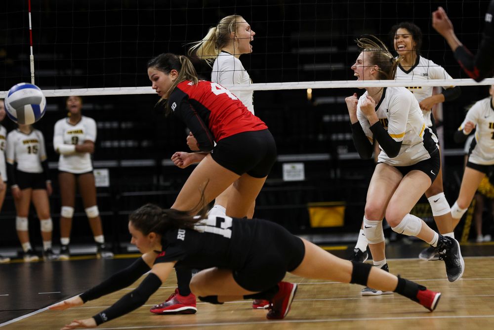 Iowa Hawkeyes right side hitter Reghan Coyle (8) and Iowa Hawkeyes middle blocker Hannah Clayton (18) celebrate after winning a point during a match against Rutgers at Carver-Hawkeye Arena on November 2, 2018. (Tork Mason/hawkeyesports.com)