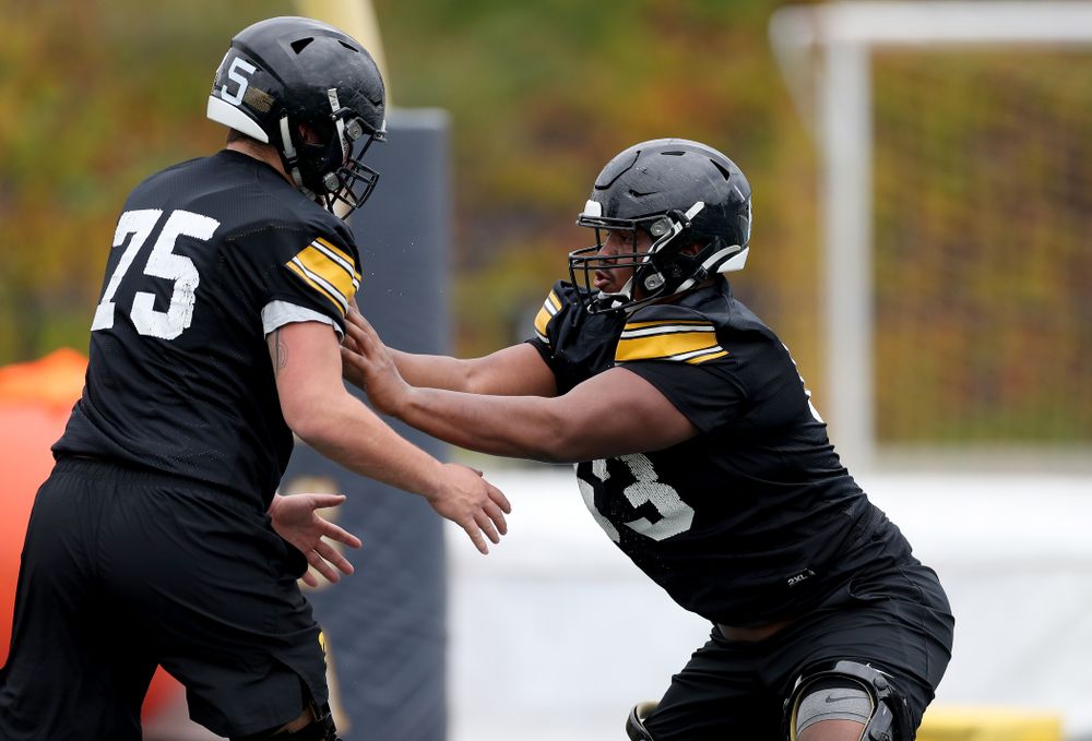 Iowa Hawkeyes offensive lineman Justin Britt (63) and offensive lineman Jeff Jenkins (75) during practice Sunday, December 22, 2019 at Mesa College in San Diego. (Brian Ray/hawkeyesports.com)