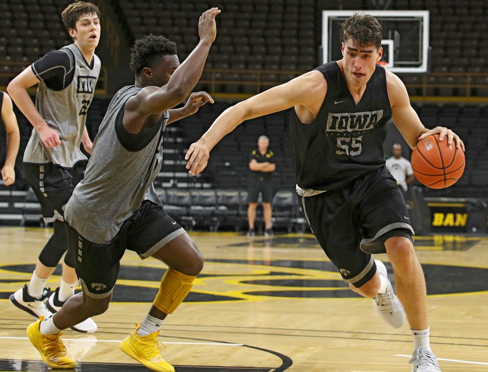 Iowa Hawkeyes center Luka Garza (55) drives on guard Joe Toussaint (1) during practice at Carver-Hawkeye Arena in Iowa City on Monday, Sep 30, 2019. (Stephen Mally/hawkeyesports.com)